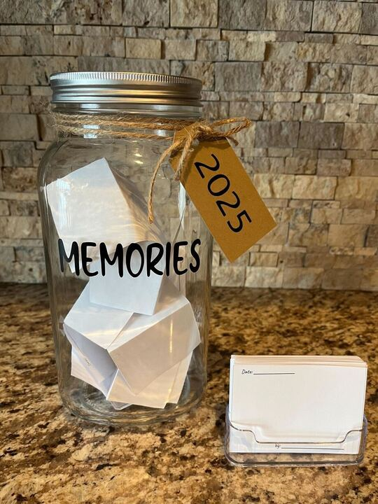 A picture of written memories placed in a jar